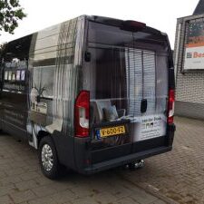 Busbelettering van der Donk woningstoffering